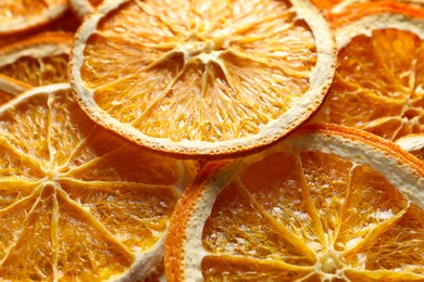 Photo of Many dry orange slices as background, closeup