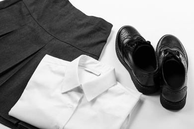 New stylish school uniform on white background, closeup