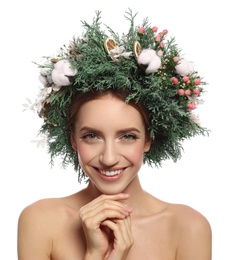 Happy young woman wearing wreath on white background