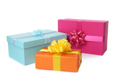 Photo of Colorful gift boxes with bows on white background