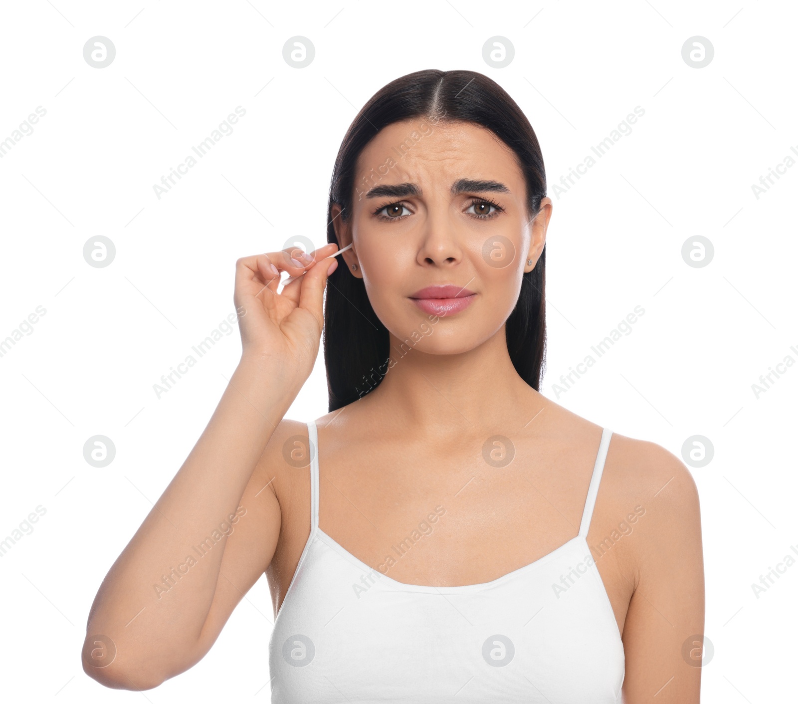 Photo of Young woman cleaning ear with cotton swab on white background