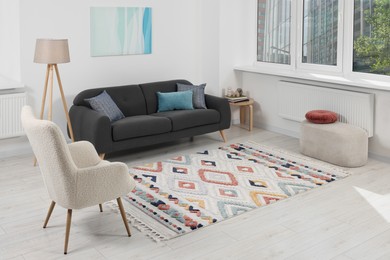 Photo of Living room with beautiful carpet and furniture