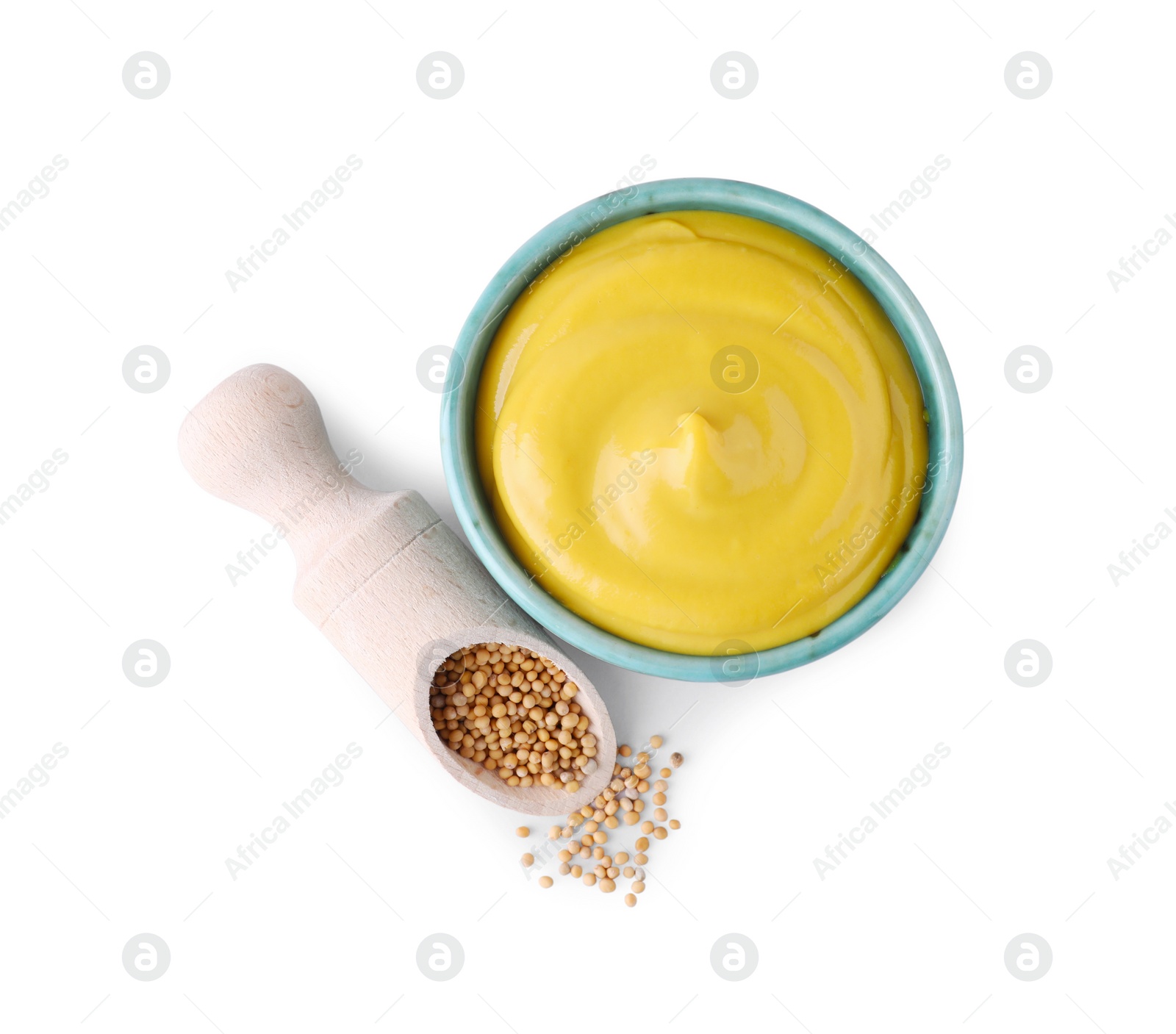 Photo of Bowl of delicious mustard and scoop with seeds on white background, top view