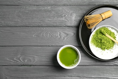 Flat lay composition with matcha tea on wooden background