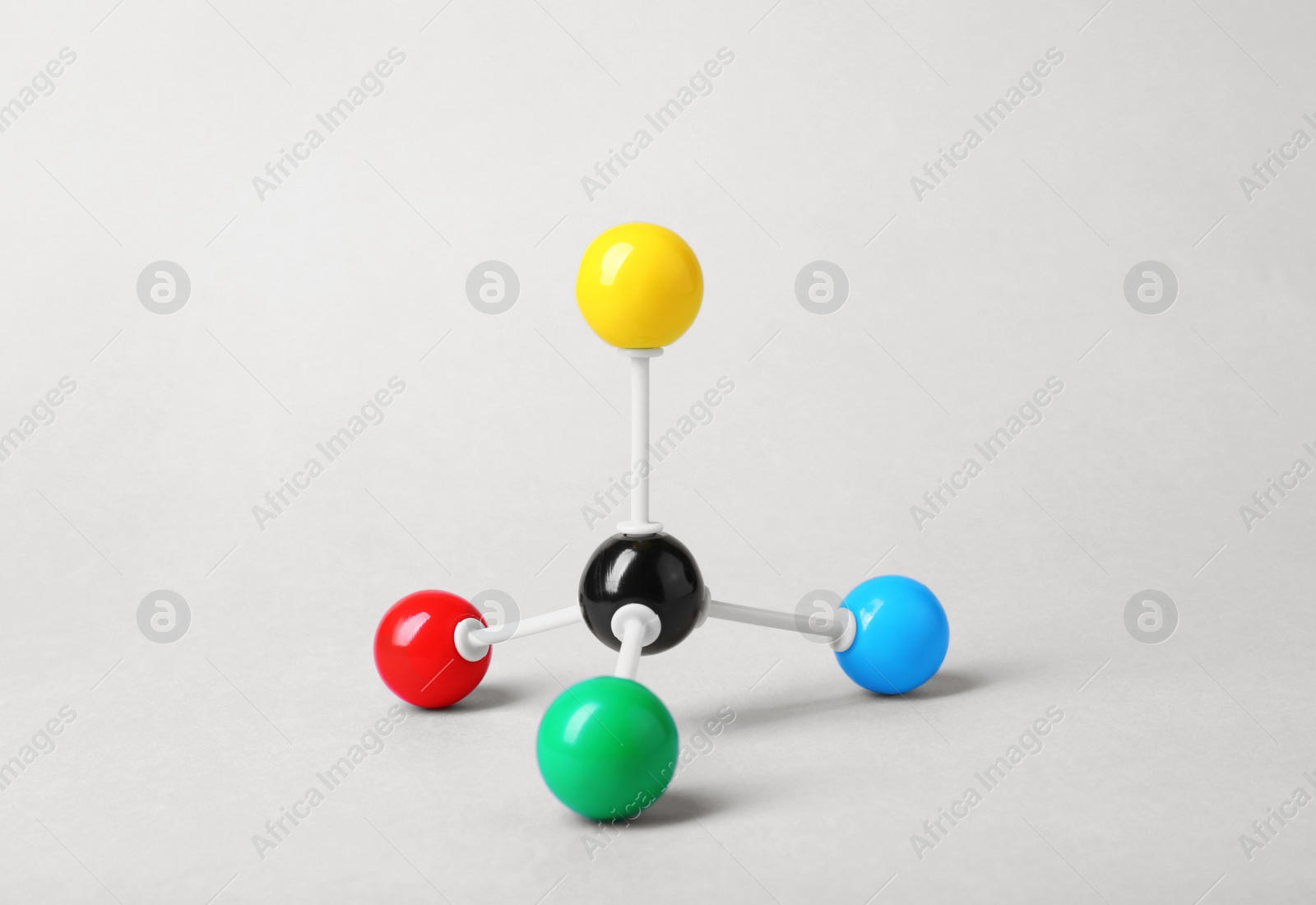 Photo of Molecular atom model on light grey background. Chemical structure