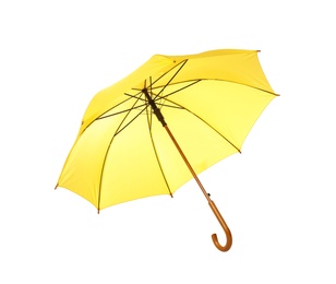 Photo of Modern opened yellow umbrella isolated on white