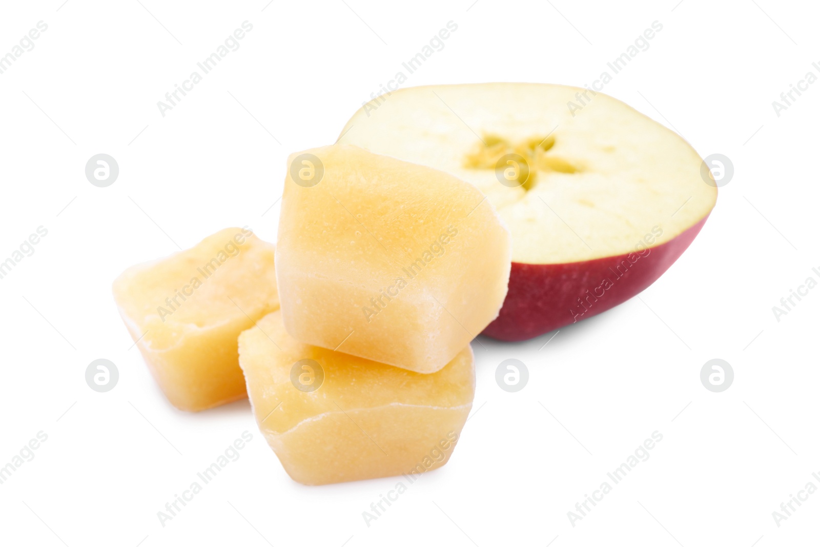 Photo of Frozen apple puree cubes and fruit on white background