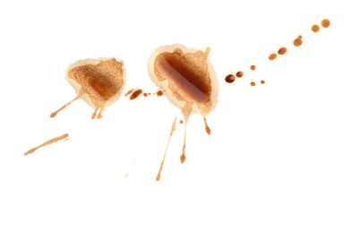 Photo of Dried coffee stains isolated on white, top view