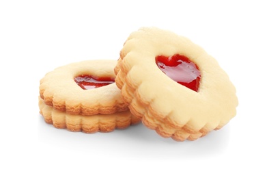 Traditional Christmas Linzer cookies with sweet jam on white background