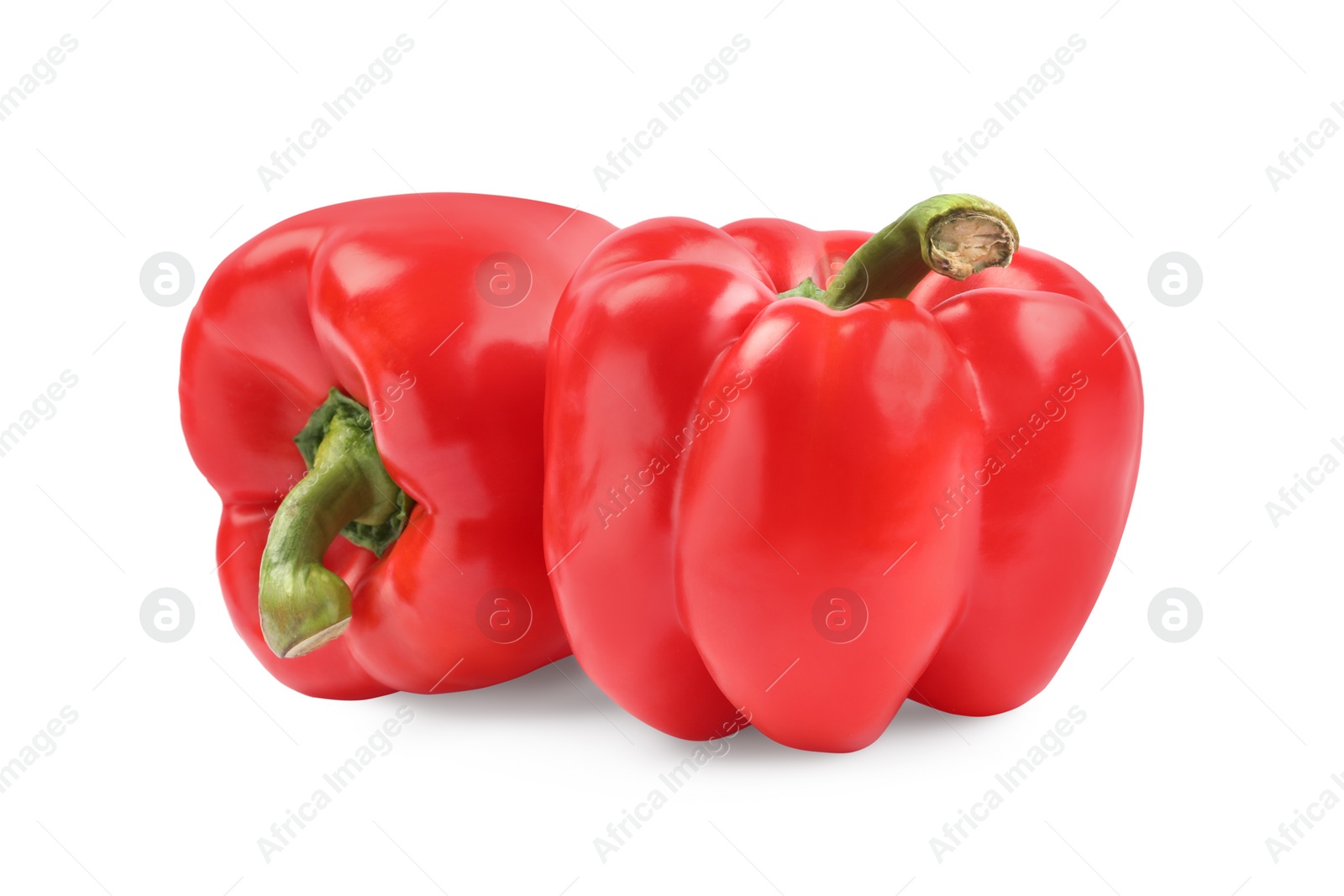 Photo of Ripe red bell peppers isolated on white