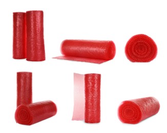 Image of Set with red bubble wrap rolls on white background