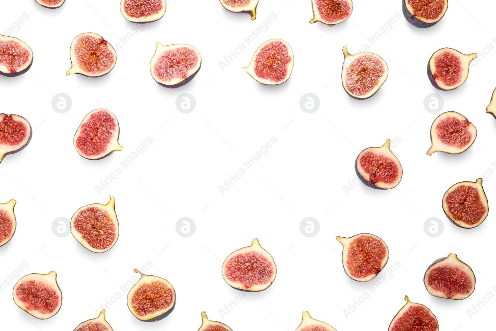 Photo of Frame made of cut ripe figs on white background, top view. Space for text