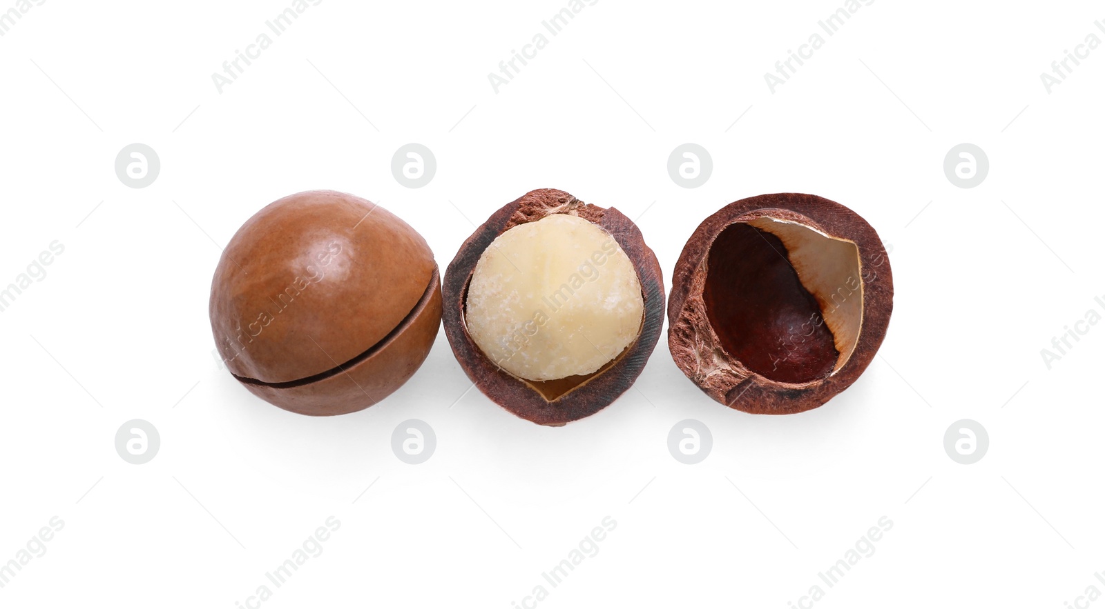 Photo of Delicious organic Macadamia nuts isolated on white, top view