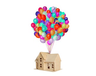 Many balloons tied to model of house flying on white background