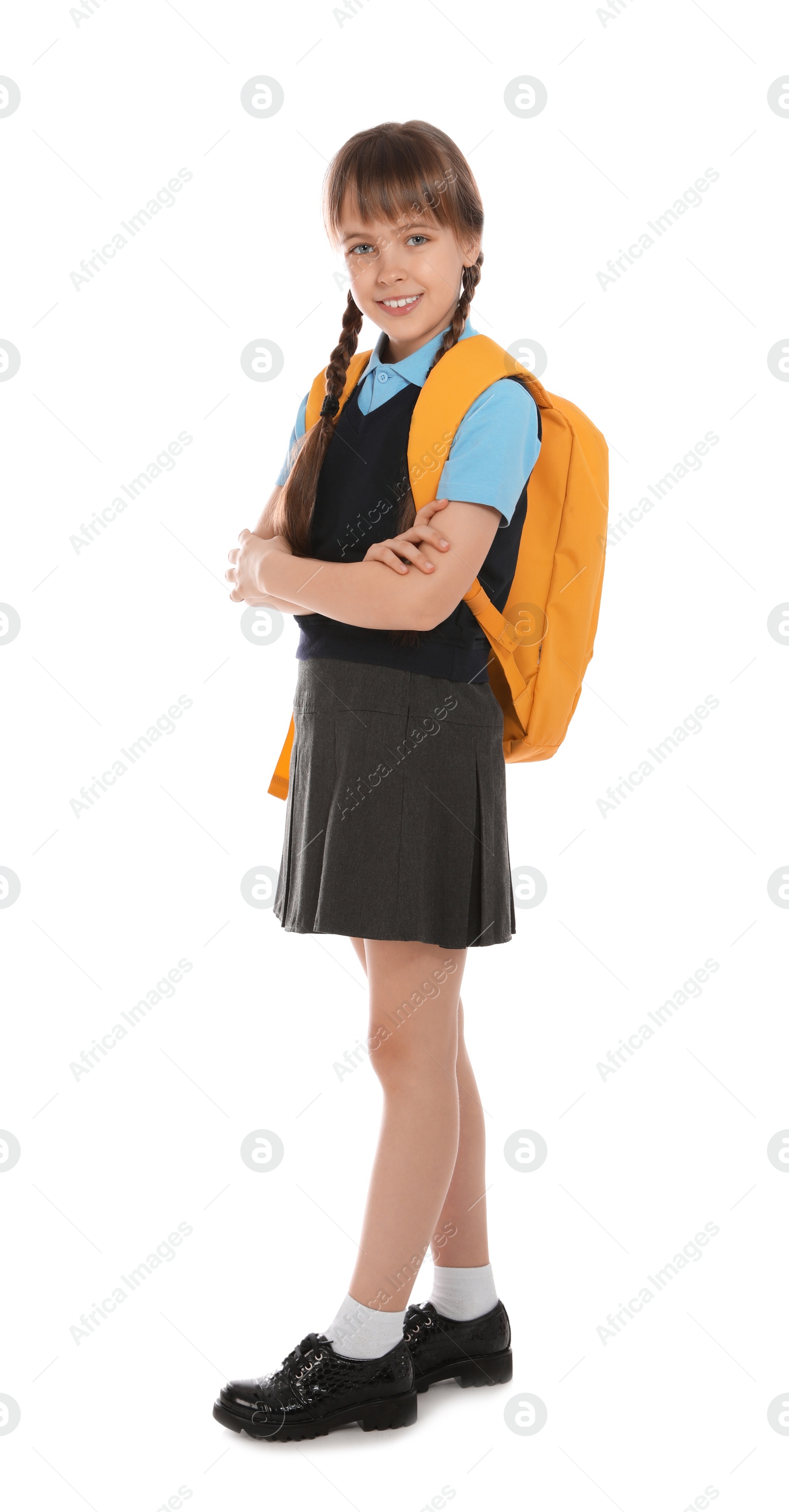 Photo of Full length portrait of cute girl in school uniform with backpack on white background