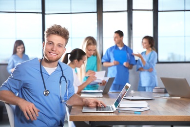 Photo of Smart medical student with his classmates in college