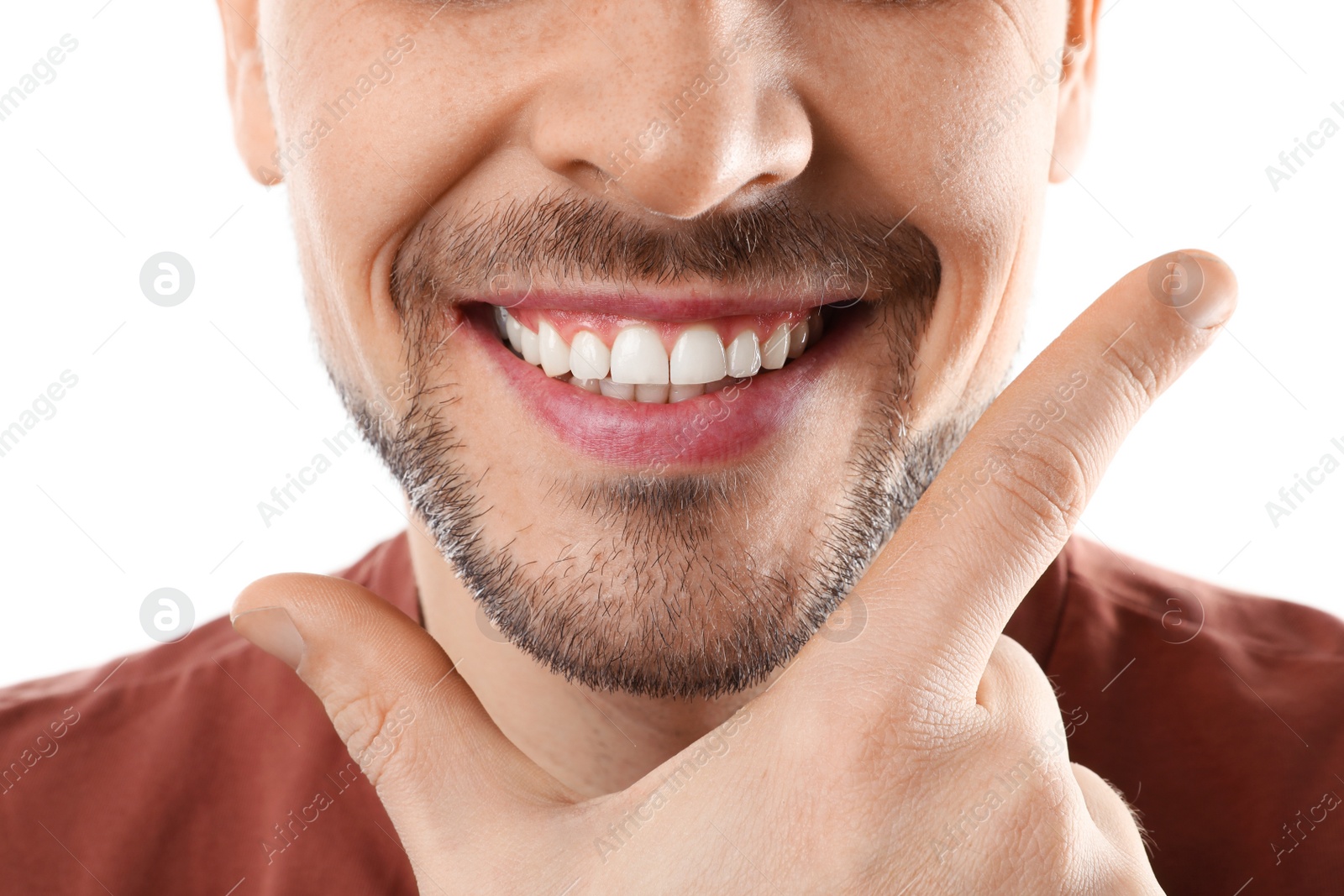 Photo of Smiling man with perfect teeth on white background, closeup