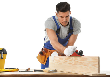 Photo of Handsome carpenter working with timber at wooden table on white background