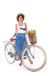 Portrait of beautiful young woman with bicycle on white background