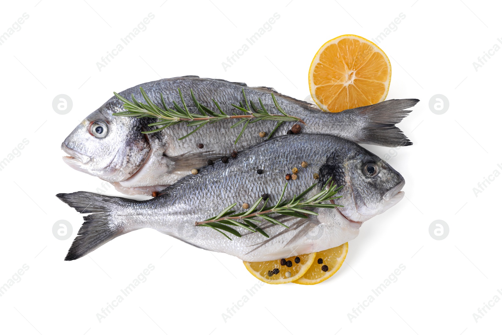 Photo of Raw dorado fish, lemon and spices isolated on white, top view