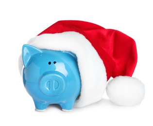 Cute piggy bank with Santa hat on white background