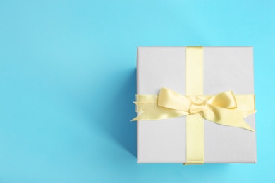 Photo of Beautifully decorated gift box on color background, top view