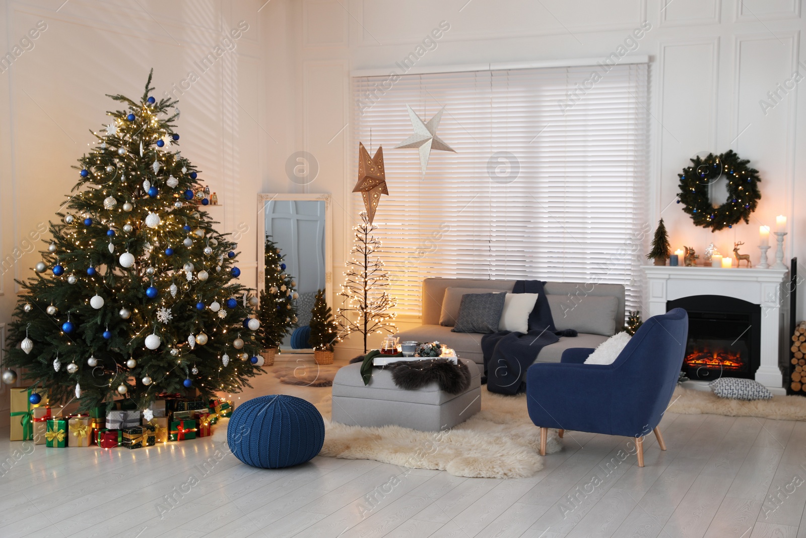 Photo of Cozy living room interior with beautiful Christmas tree and comfortable furniture