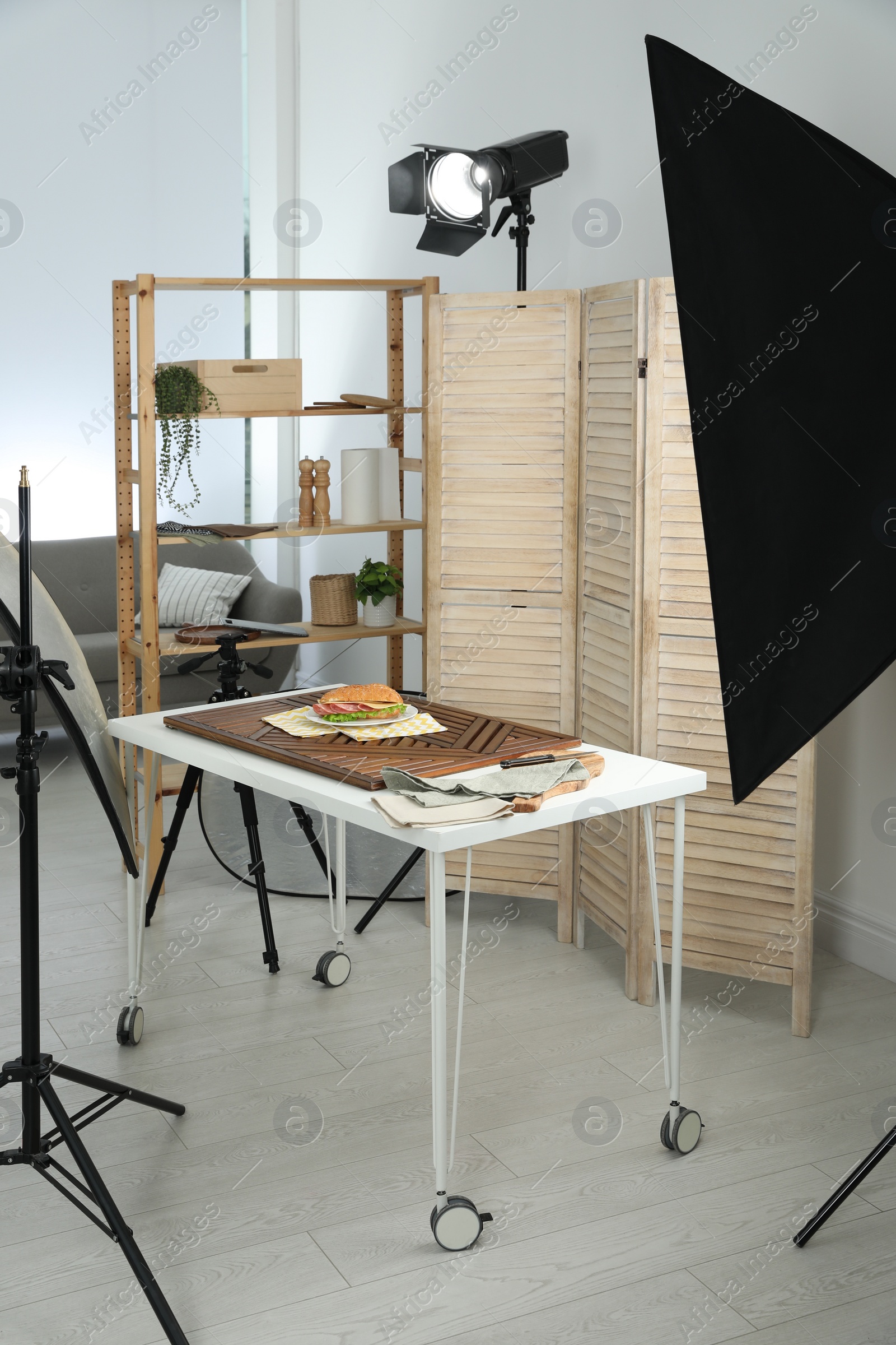 Photo of Tasty sandwich on table in photo studio. Food photography