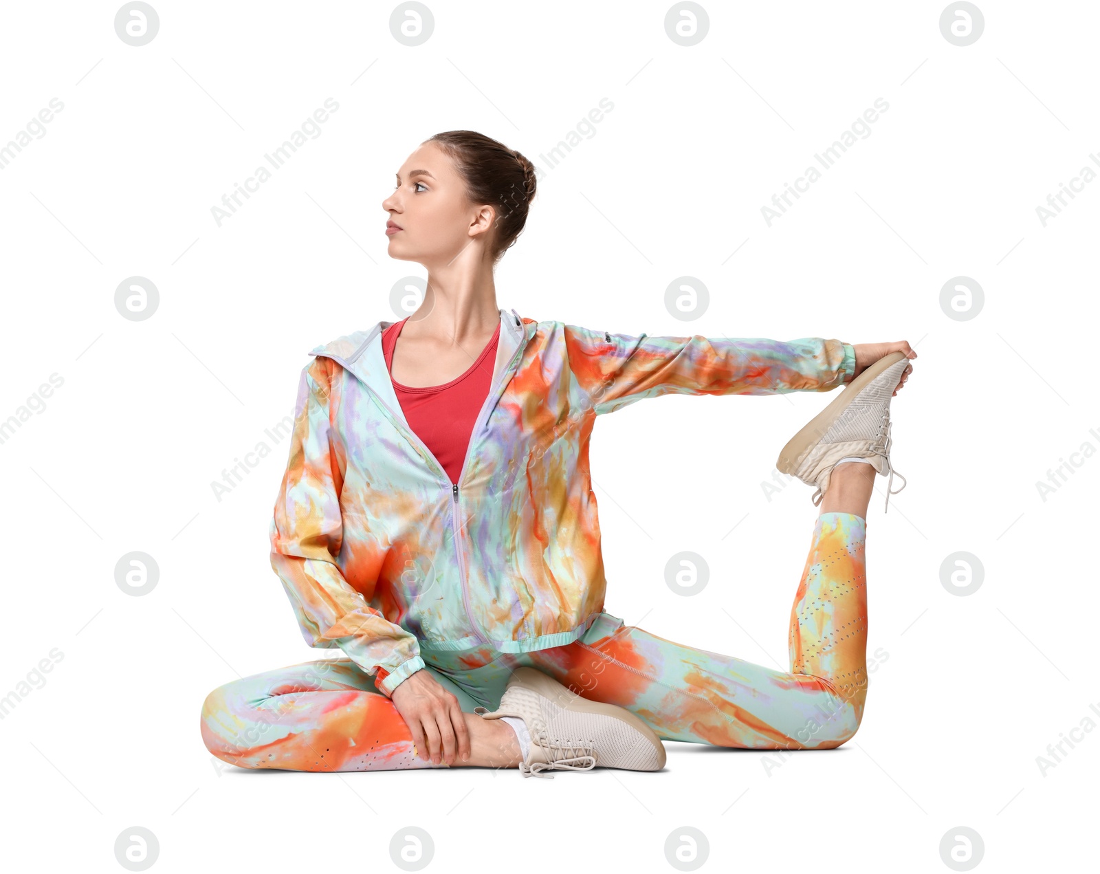 Photo of Yoga workout. Young woman stretching on white background