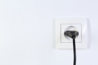 Photo of Power socket and plug on white background. Electrician's equipment