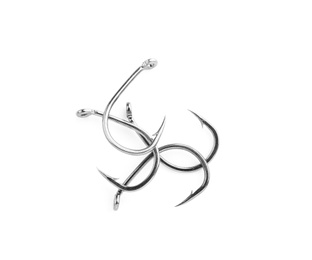 Photo of Metal hooks on white background. Fishing accessories