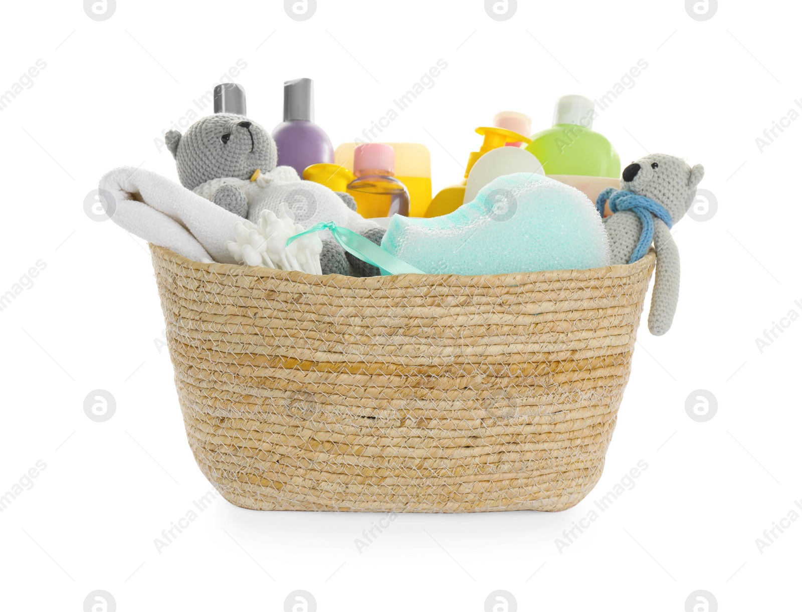 Photo of Wicker basket full of different baby cosmetic products, bathing accessories and toys on white background