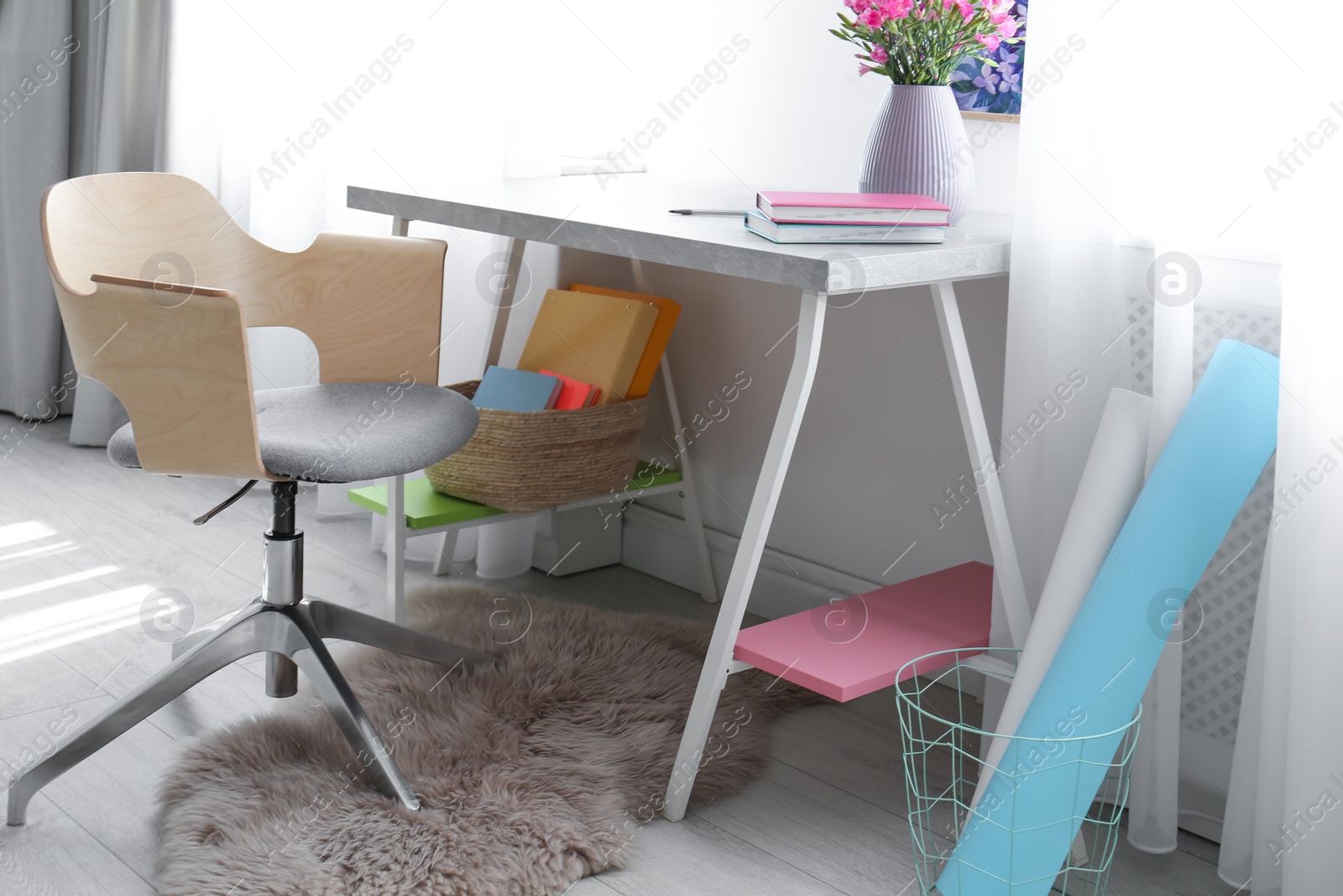 Photo of Comfortable workplace with office chair and modern table