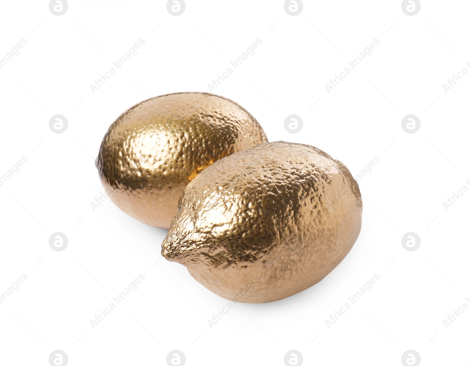 Photo of Shiny stylish golden lemons on white background