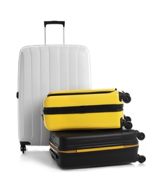 Modern suitcases for travelling on white background