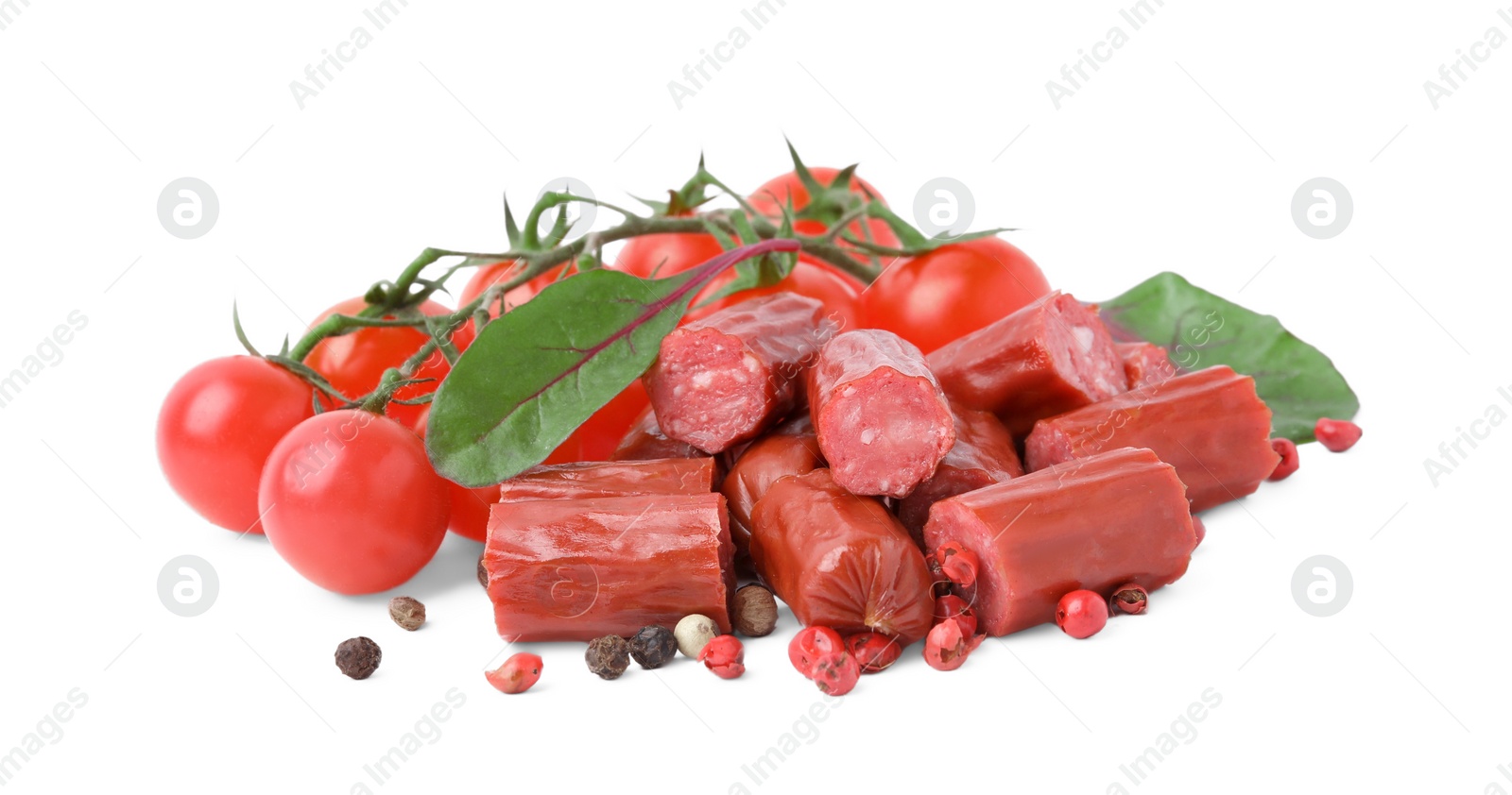 Photo of Delicious smoked sausages, tomatoes, pepper and spinach isolated on white