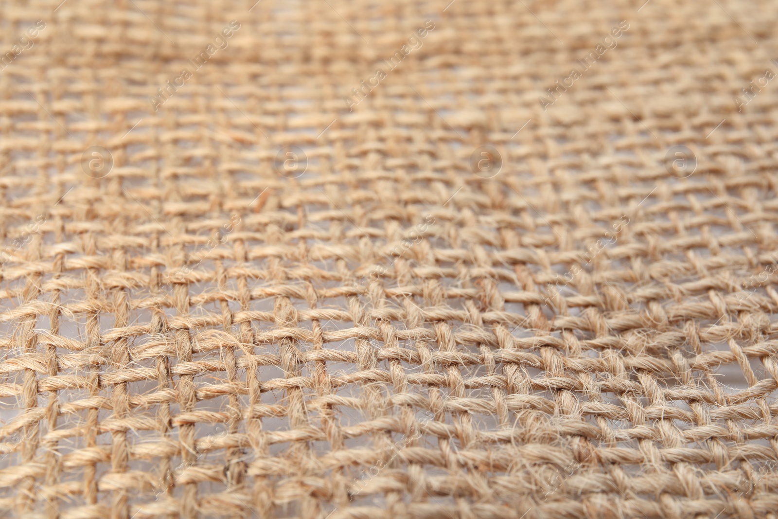 Photo of Texture of sustainable hemp fabric as background, closeup