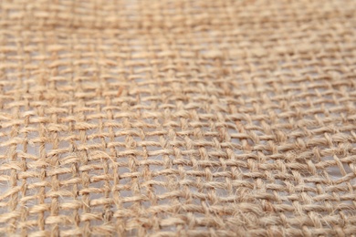 Texture of sustainable hemp fabric as background, closeup