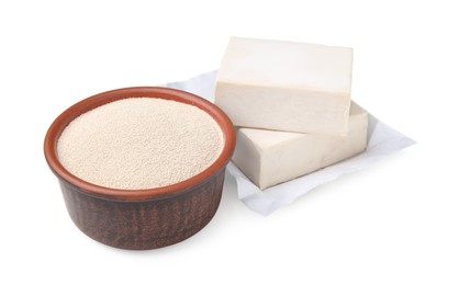 Photo of Compressed and granulated yeast on white background