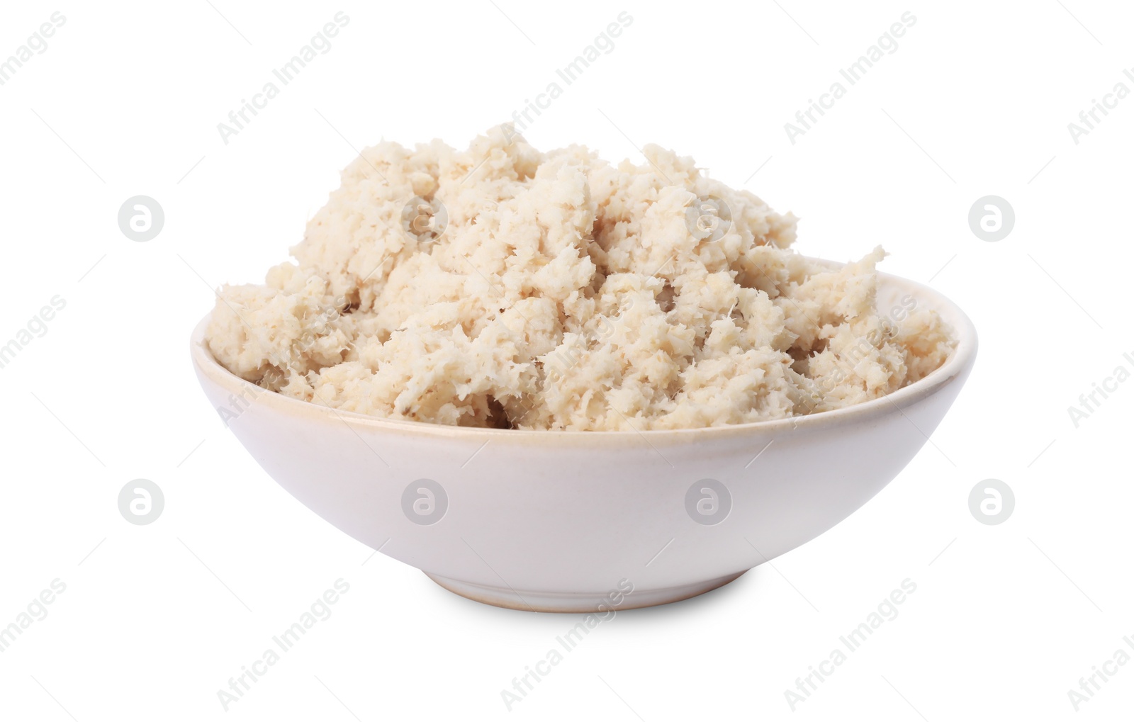 Photo of Bowl of tasty prepared horseradish isolated on white