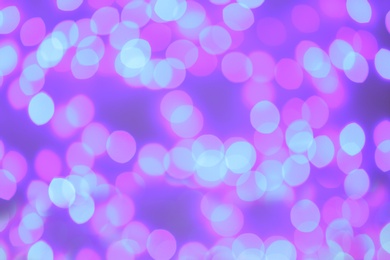 Photo of Beautiful glowing lights as background. Bokeh effect