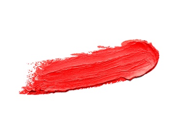 Photo of Stroke of lipstick on white background, top view