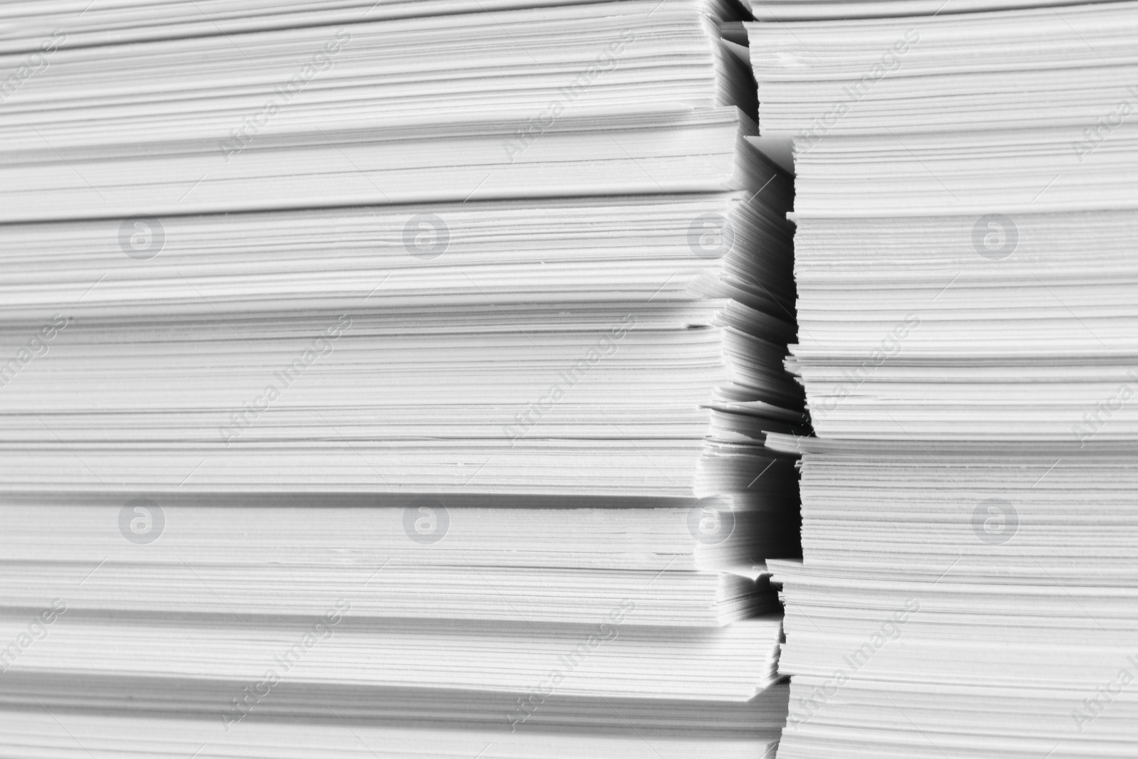 Photo of Stacks of white paper sheets, closeup view