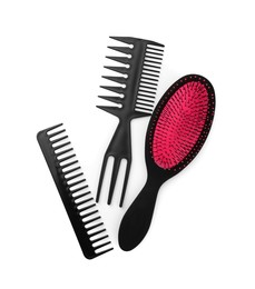 Set of hair brush and combs isolated on white, top view