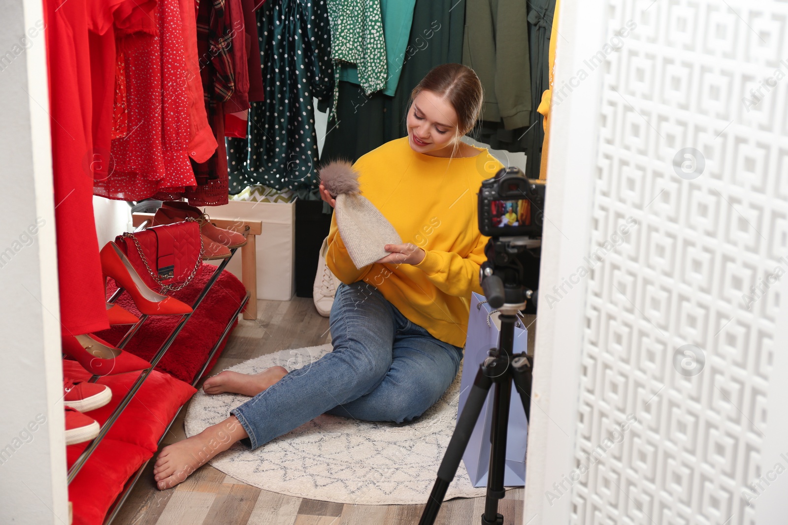 Photo of Fashion blogger recording new video in dressing room