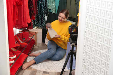 Fashion blogger recording new video in dressing room