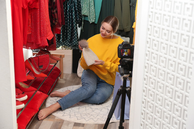 Photo of Fashion blogger recording new video in dressing room