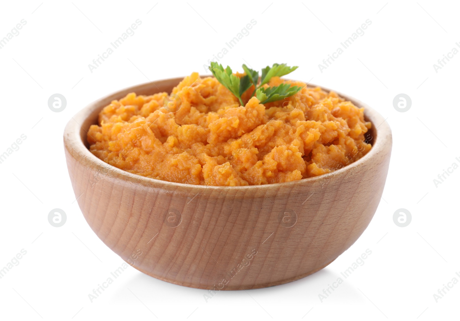 Photo of Bowl with mashed sweet potatoes on white background