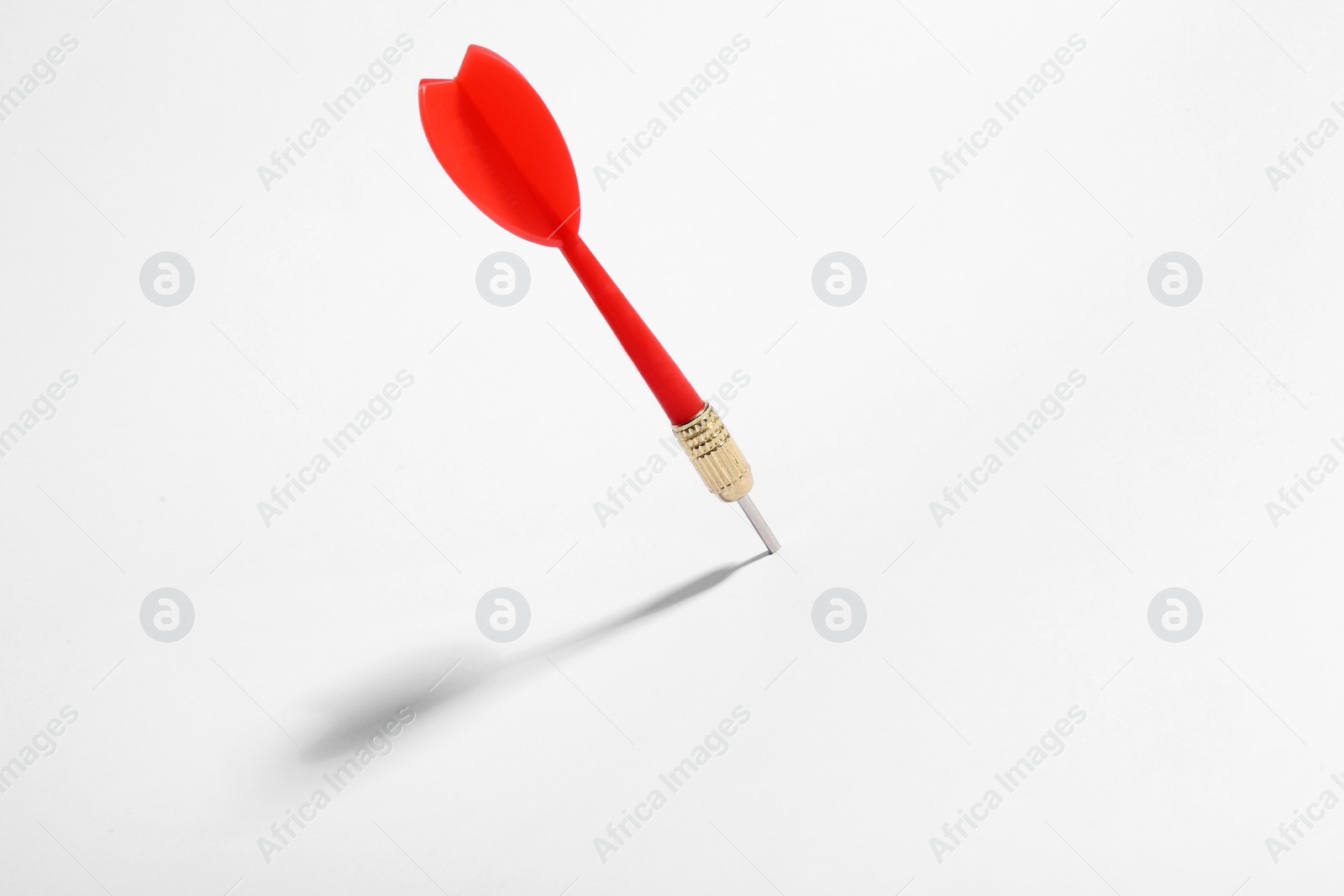 Photo of Red dart arrow for game on white background