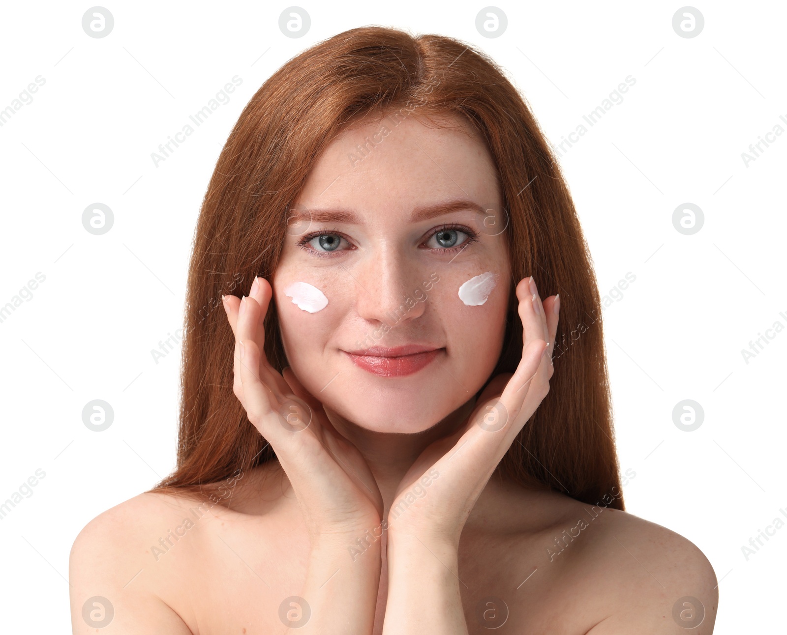 Photo of Beautiful woman with freckles and cream on her face against white background